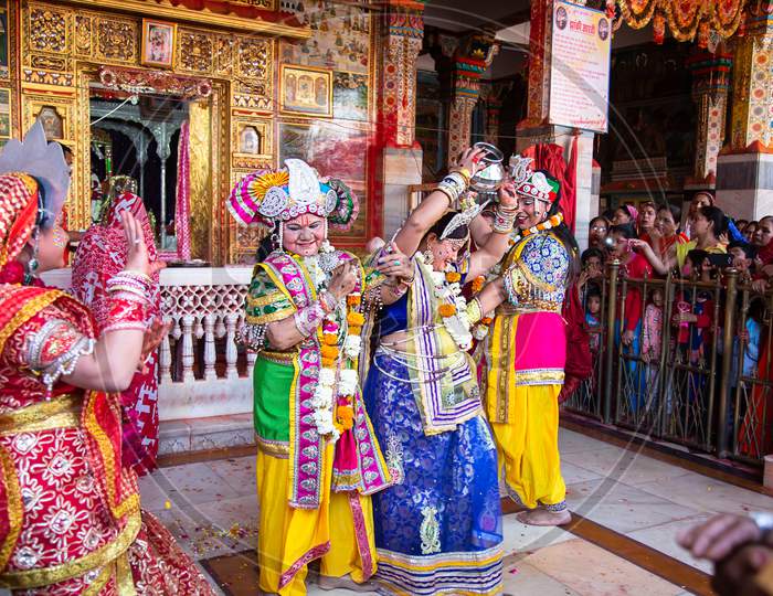Jodhpur, Rajastha, India - March 20, 2020: People Performing Lord Krishna And And Gopi Sattriya Dance, Happy Janmashtami Festival Concept Background, Playing Holi.