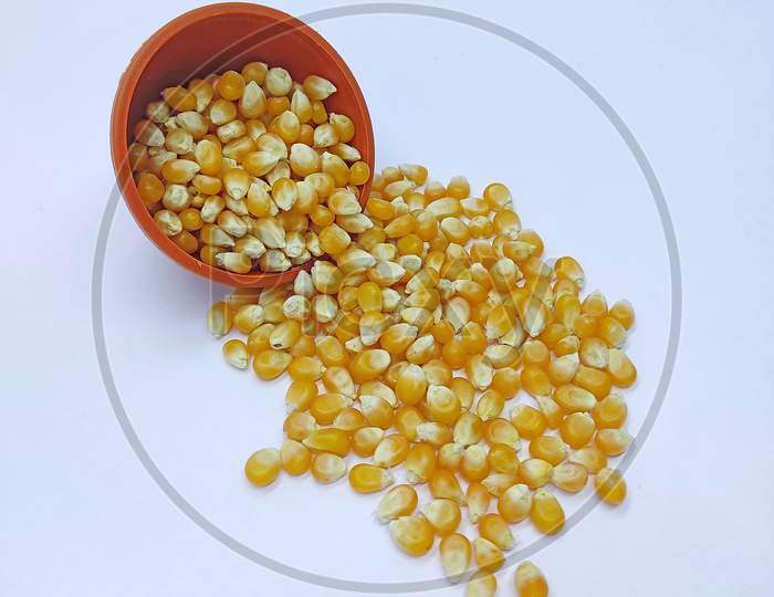 Corn Kernels, Corns Seeds, Yellow Dry Corn Grains Isolated On White Background, Falling Pouring From A Bowl