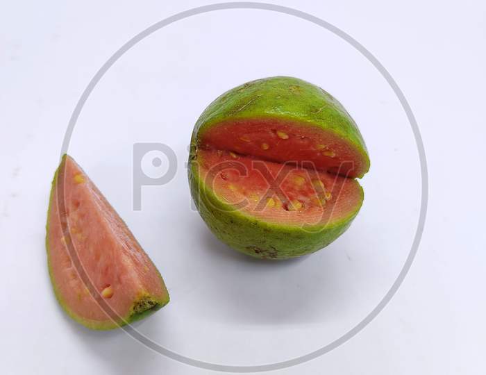 Guavas. One Whole Guava Fruit, A Half And A Slice With Pink Flesh Isolated On White Background