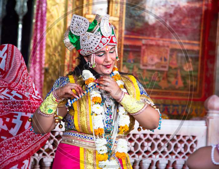 Jodhpur, Rajastha, India - March 20, 2020: People Performing Lord Krishna And And Gopi Sattriya Dance, Happy Janmashtami Festival Concept Background, Playing Holi.