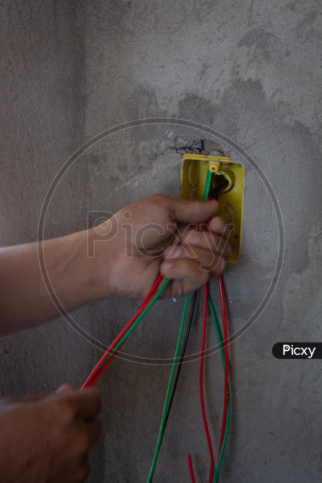 Electrician Working On A Construction Site. Electrical Wiring In A Construction.