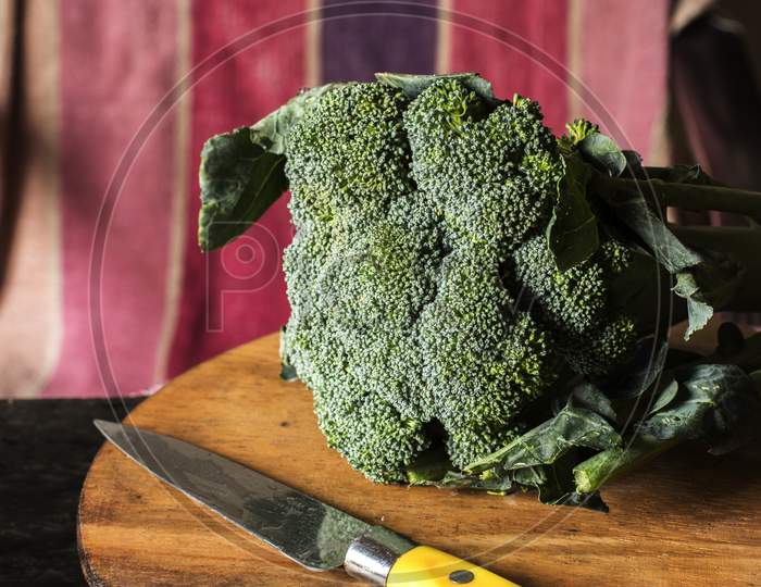 Fresh Organic Broccoli On Wooden Table.