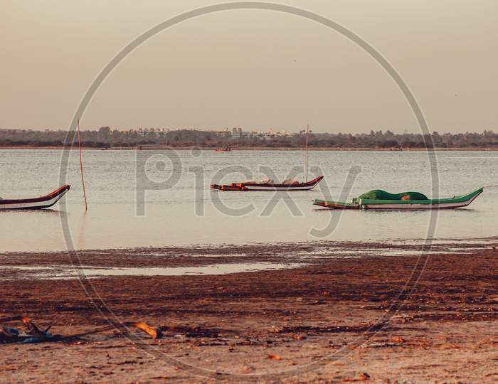 View Of The Fisherman Boats In A Lake Along The East Coast Road, Tamil Nadu, India. Selective Focus On Boat