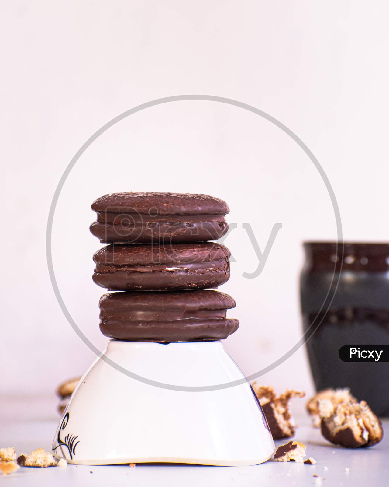 Food photography of lotte choco pie with cup, bowl, some stuffs using white background