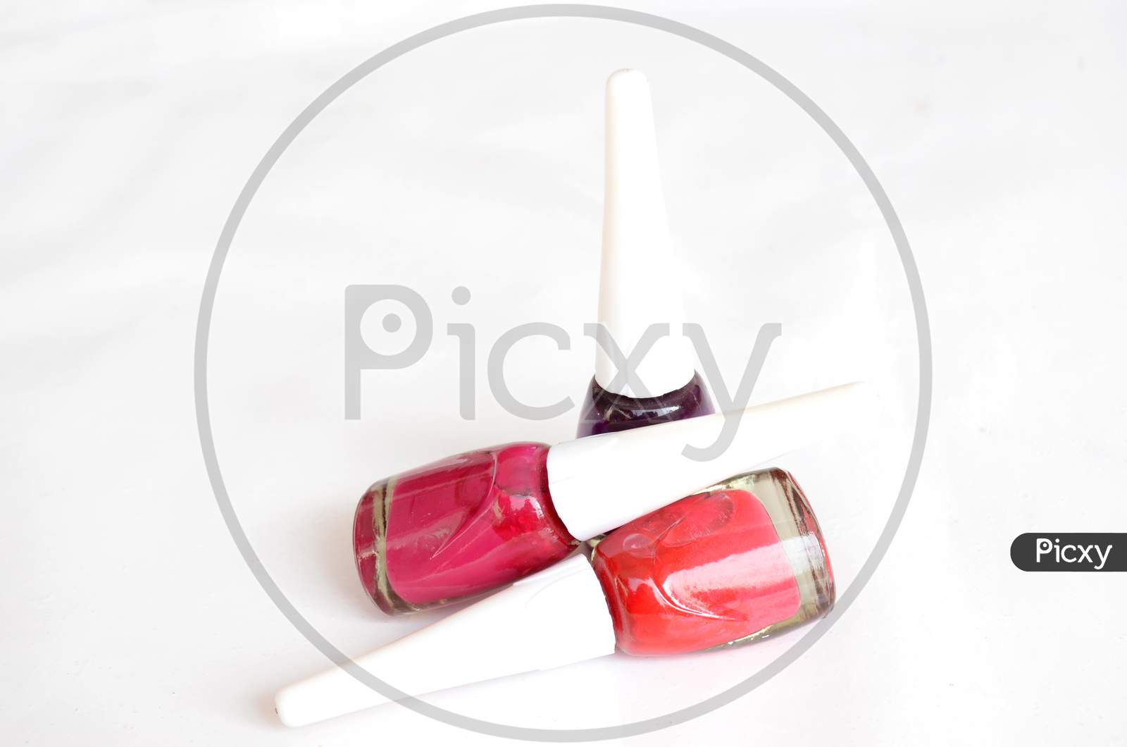 The Colorful Nail Police Glass With Plastic Bottle Isolated On White Background.