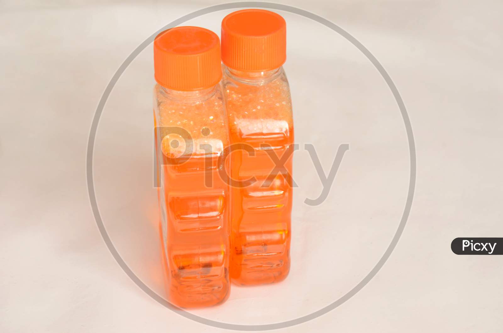 The Orange Color Sanitizer Plastic Bottle Isolated On White Background.