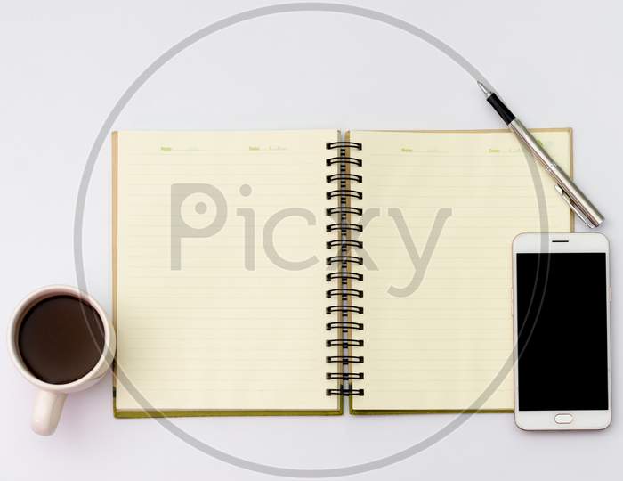 Flay Lay Space On The Desk  Area Space Enter Text. Mockup Coffee Cups Snack Candy,  Pen Note Paper Placed On A White Table Top View Desk Table With  Top View With Copy Space Phone Smartphone