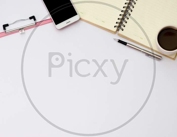 Flay Lay Space On The Desk  Area Space Enter Text. Mockup Coffee Cups Snack Candy,  Pen Note Paper Placed On A White Table Top View Desk Table With  Top View With Copy Space Phone Smartphone