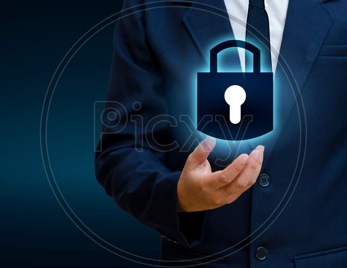 Lock In The Hands Of A Businessman Shield The Shield To Protect The Cyberspace.Space Input Data Data Security Business Internet Concept. Secure Information