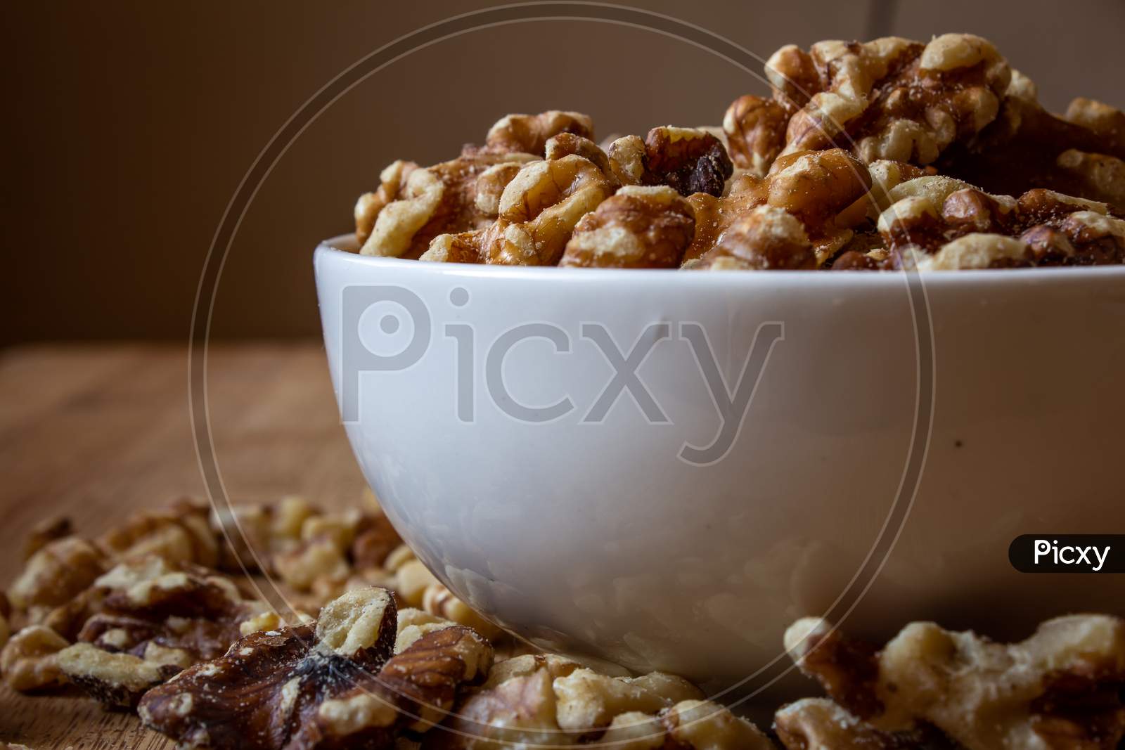 View Of Deshelled Walnuts In A Bowl. Use For Healthy Food Concept