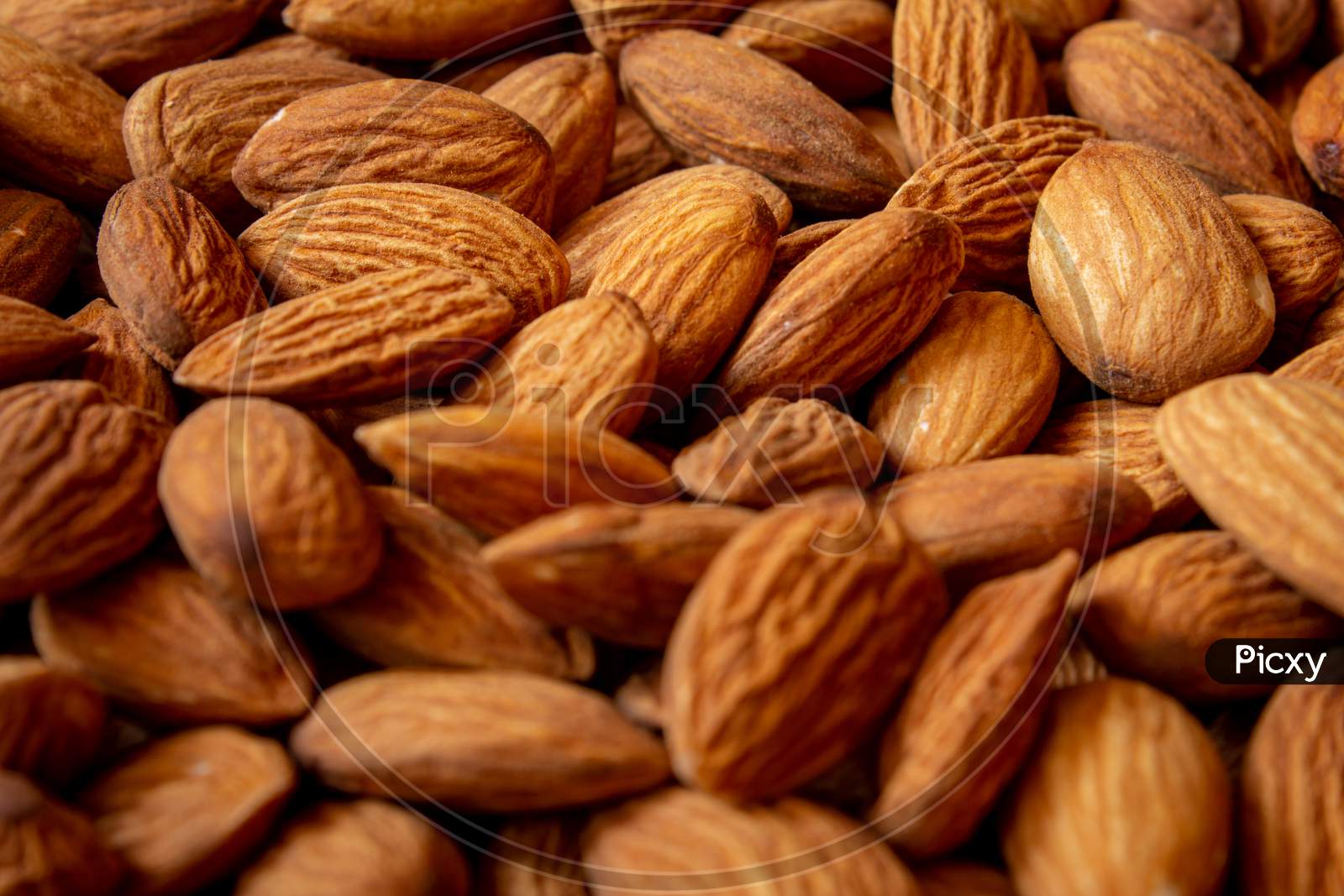 Top View Of Almonds In A Heap. Use For Healthy Snack Concept.