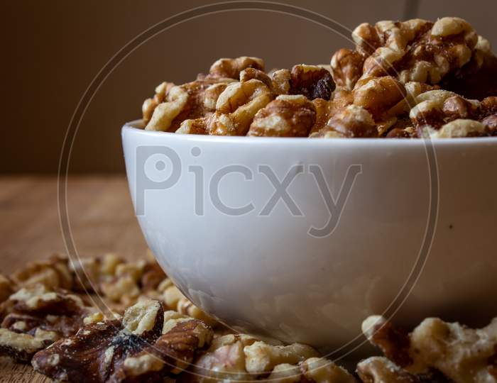 View Of Deshelled Walnuts In A Bowl. Use For Healthy Food Concept