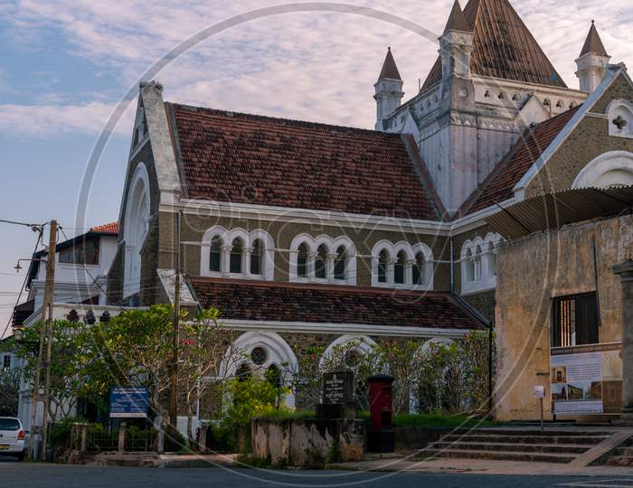 All Saint'S Church In Galle Dutch Fort View From A Low Angle In The Evening Light Hitting On The Roof Top And Lighten Behind The Church Walls.