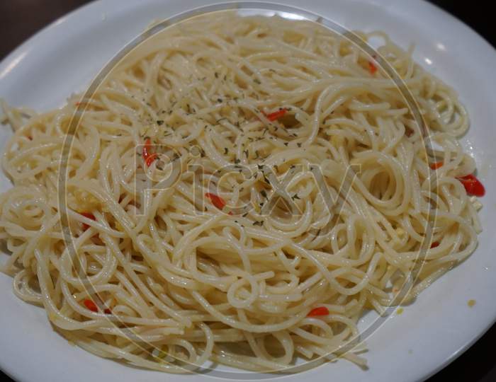 Spaghetti with olive oil, garlic and red chillies.