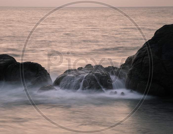Long Exposure Silky Smooth Saltwater Foam And Rock Formation In The Evening,