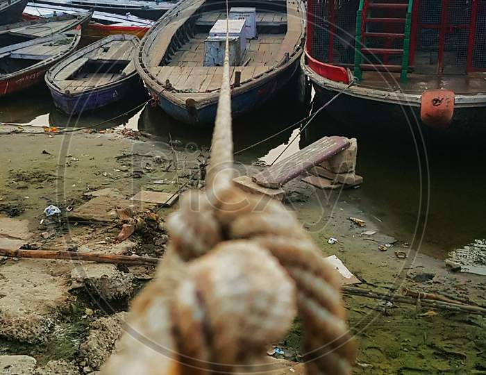 Tightly Knotted Boat At The Bank Of River Ganges