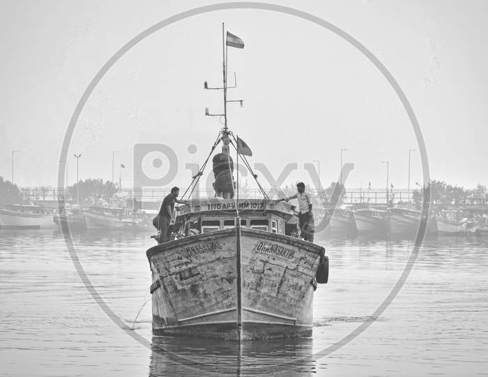 Fisherman traveling on boat