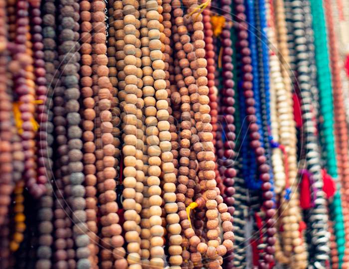 Wooden Prayer Worry Beads On String Used As A Way To Reduce Stress And Relax Sold In An Open Shop As A Tourist Attraction Near Hinduism Buddhism Temple