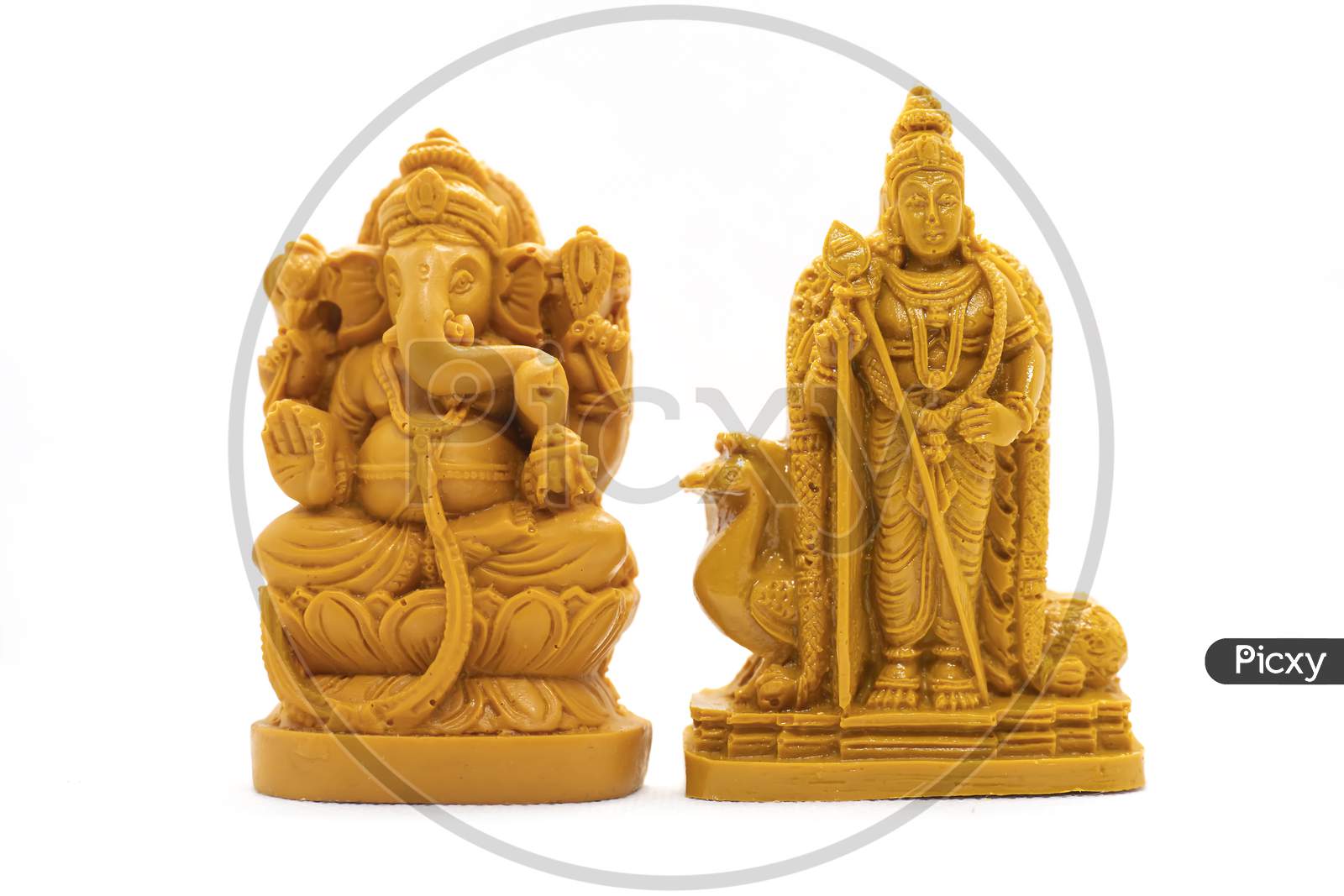 The Hand-Carved Wooden Idol Of Lord Murugan With Ganesha Is Isolated On A White Background