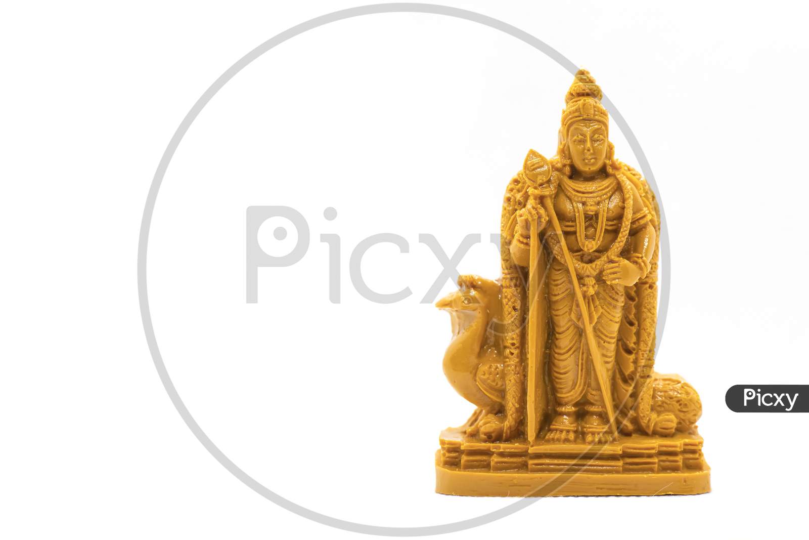 The Hand-Carved Wooden Statue Of Lord Murugan Is Isolated On A White Background