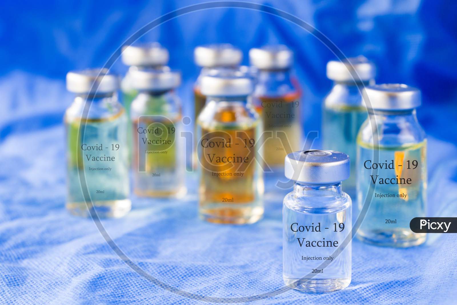 Corona Virus And Covid - 19 New Vaccine In Ampules, Different Color Variations Of Vaccine