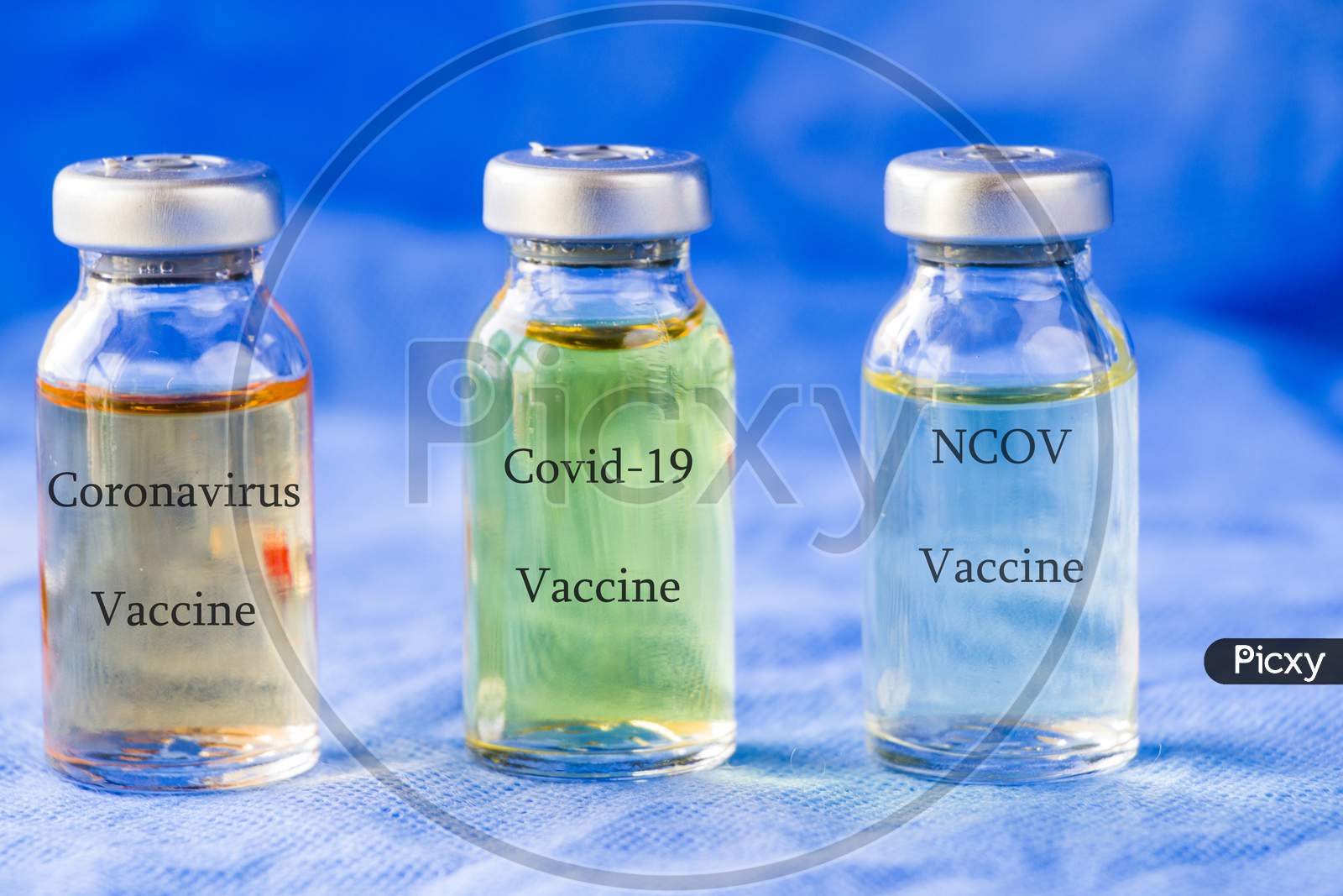 Corona Virus And Covid - 19 New Vaccine In Ampules, Different Color Variations Of Vaccine