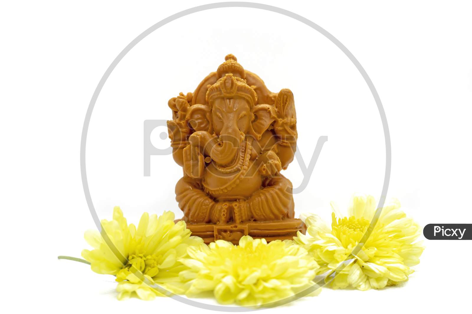 Ganesha Statue Of Hindu God With Flowers On White Background.