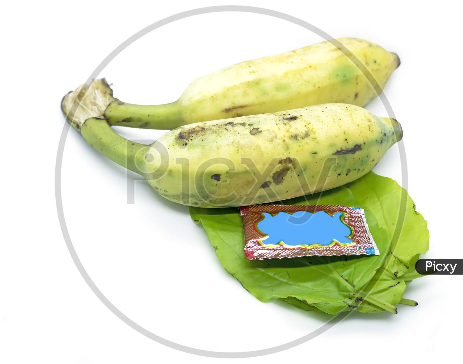 South Indian Prayer Items Bananas With Green Betel Leaf And Pakku Isolated On White Background