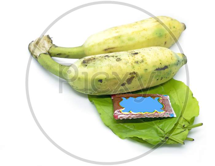 South Indian Prayer Items Bananas With Green Betel Leaf And Pakku Isolated On White Background