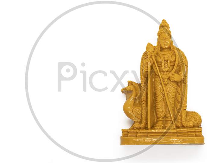 The Wooden Statue Of Lord Murugan Is Isolated On A White Background
