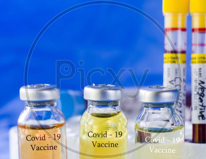 Corona Virus And Covid - 19 New Vaccine In Ampules And Blood Tube, Variations Of Vaccine