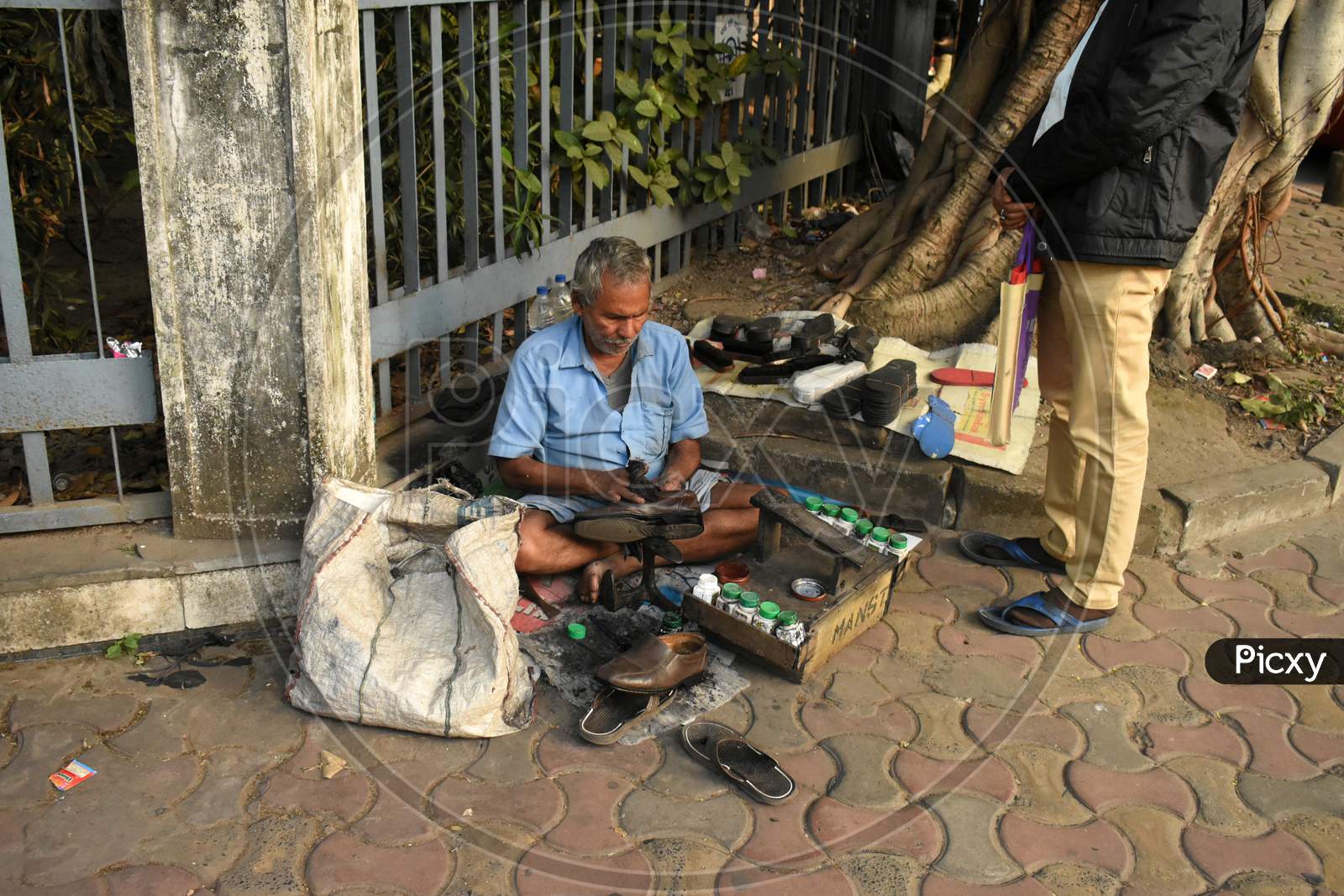 A cobbler on the street.
