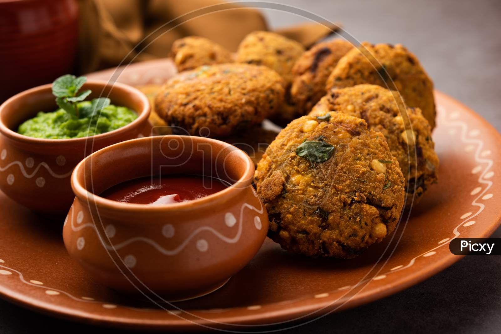 Parippu Or Paruppu Vadai Or Masala Chana Dal Vada Served In A Plate With Ketchup