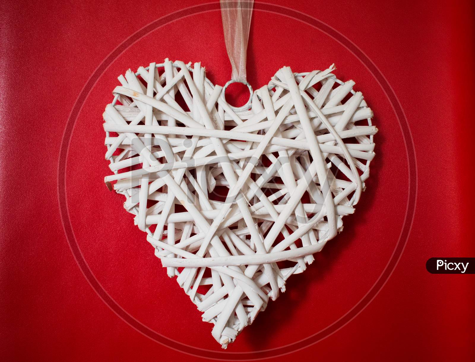 White Wooden Heart On Red Background For Valentine Day