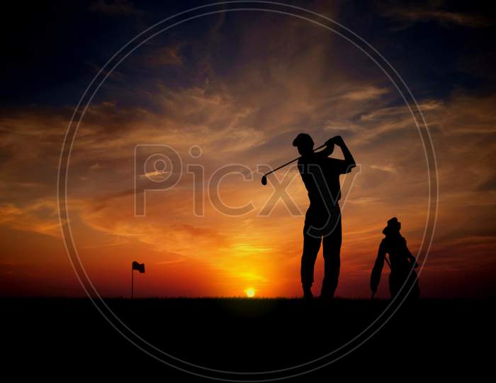 Golfer At Sunset