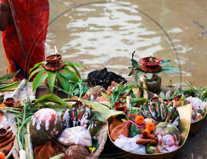 Holy Offerings Of Fruits Flowers Lamps And Cloths In River To Sun God On The Occasion Of Chhath Puja Or Chatt Puja