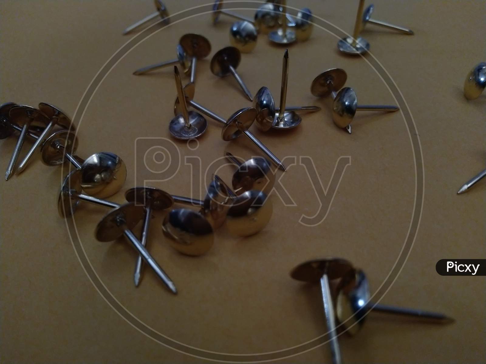 small paper pins on ground