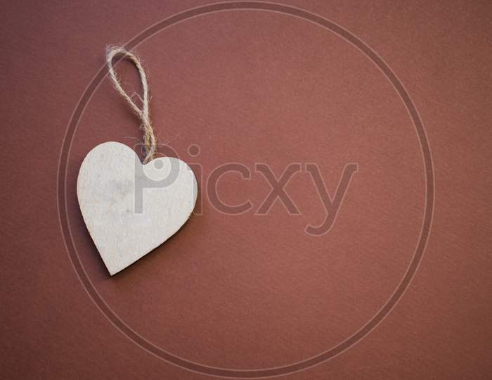Wooden Heart On Brown Background.Love Concept.