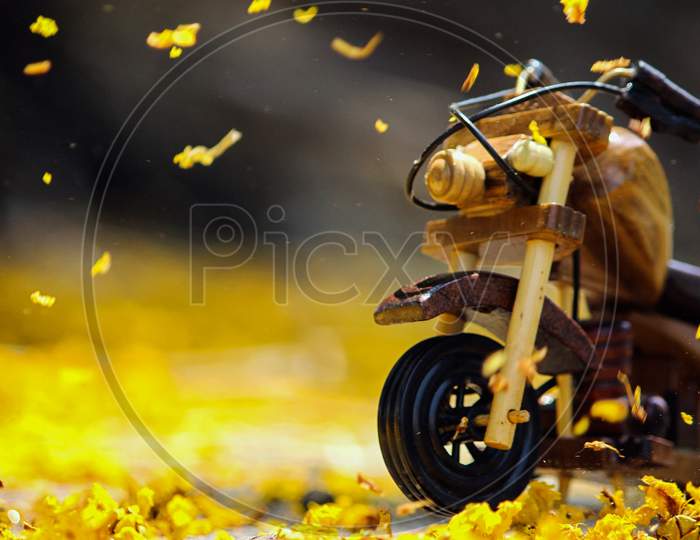 Vertical shot of motorcycle on road in autumn