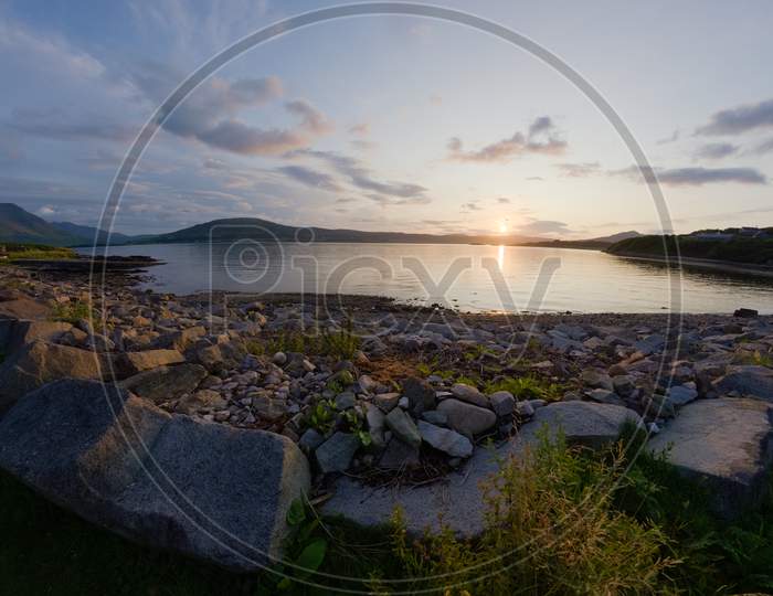 East Suisnish, Isle Of Raasay. Fish Eye Image Of Rocky Bay Sunset.