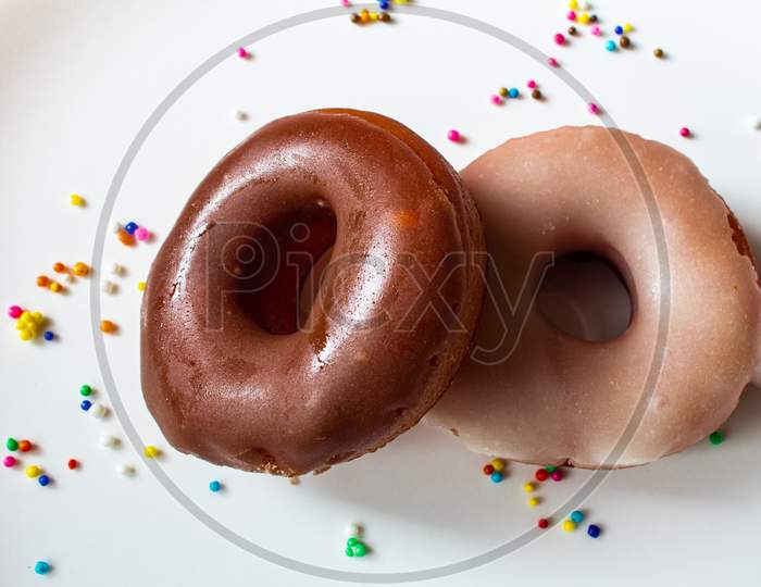 View Of Glazed Donuts With Sugar And Chocolate