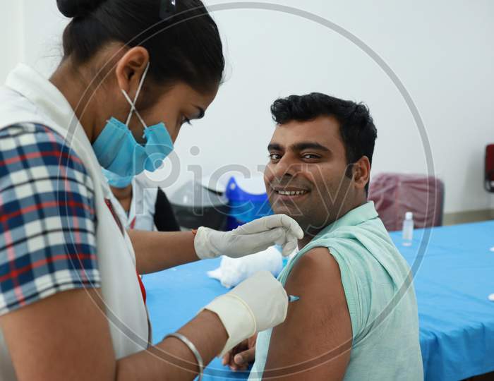 February 20,2021, Kishanganj, Bihar, India. Health Worker Receives Covid 19 Vaccination Second Injection Shot By Nursing Staff