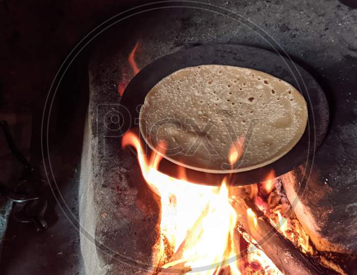 Gas Fire And Indian Bread