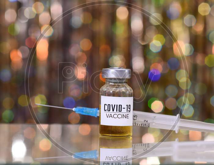 Coronavirus Vaccine And Syringe Injection. Treatment From Corona Virus Infection.