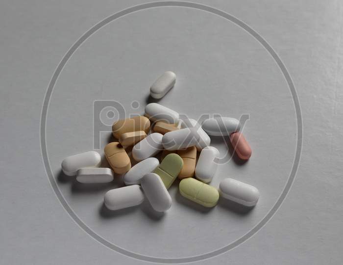 Colorful Medical Pills Isolated On A White Background