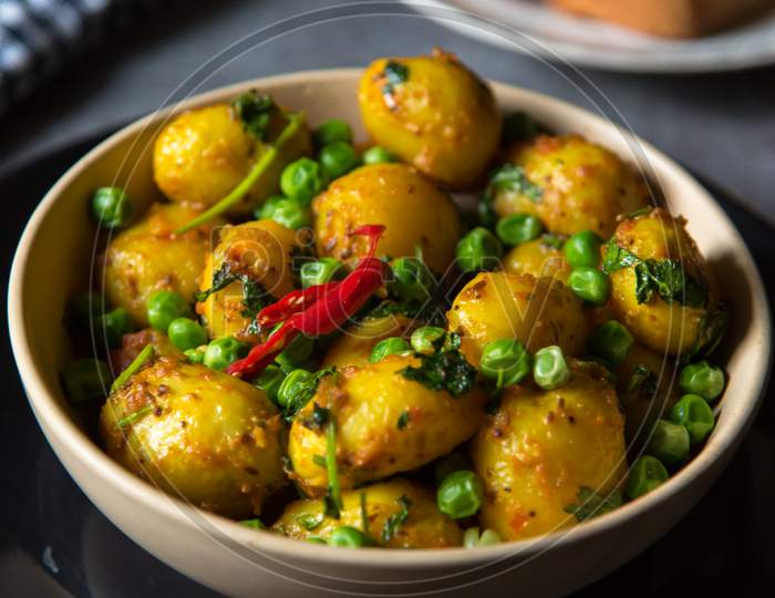 Indian dum aloo or potatoes, a spicy dish in a bowl.