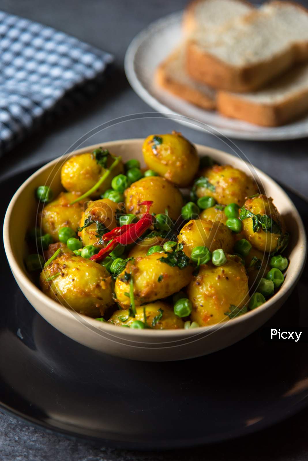 Indian dum aloo or potatoes, a spicy dish in a bowl.