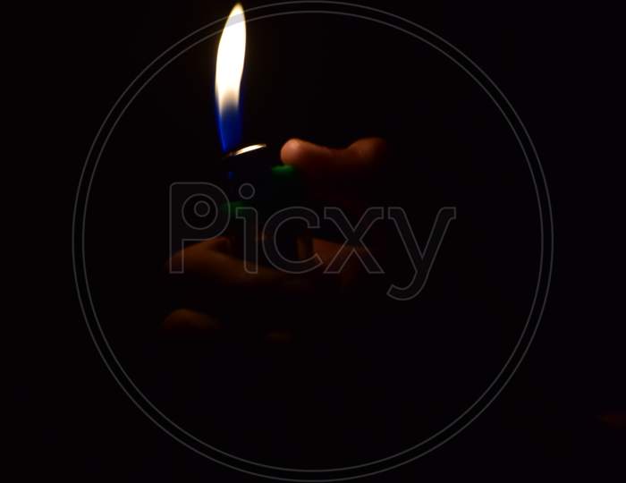 Flame of lighter with dark background