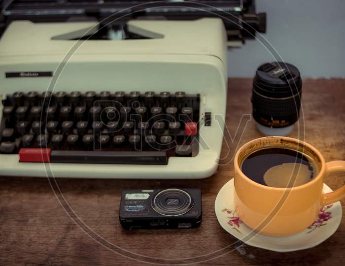 Old typewriter and a cup of coffee