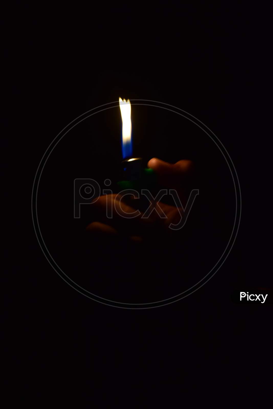 Flame of lighter with dark background